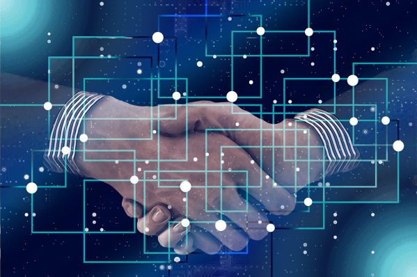 technology partnership handshake